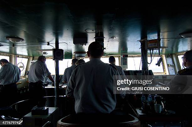 Naval officers man the bridge of the Belgian Navy Vessel Godetia, one of the fleet of EU Navy Vessels taking part in the Triton migrant rescue...