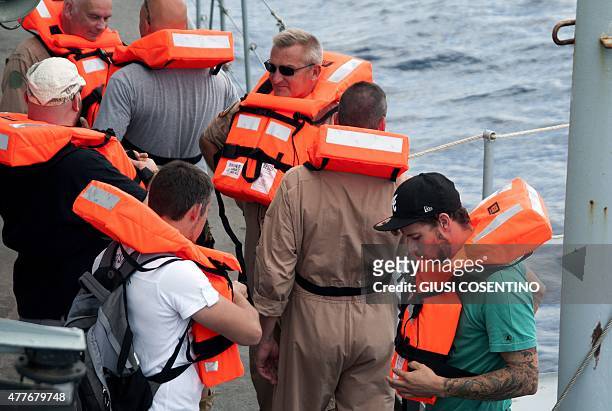 Naval personnel don life jackets on board the Belgian Navy Vessel Godetia, one of the fleet of EU Navy Vessels taking part in the Triton migrant...