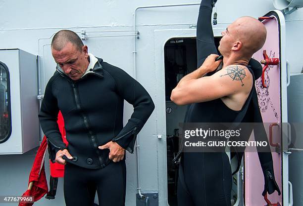 Naval personnel don wet suits onboard the Belgian Navy Vessel Godetia, one of the fleet of EU Navy Vessels taking part in the Triton migrant rescue...