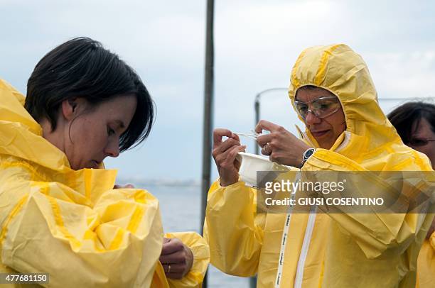 Rescue personnel don waterproof clothing and masks onboard the Belgian Navy Vessel Godetia, one of the fleet of EU Navy Vessels taking part in the...