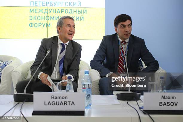 Ramon Laguarta, chief executive officer in Europe for PepsiCo Inc., left, sits next to Maxim Basov, chief executive officer of Ros Agro Plc, during a...