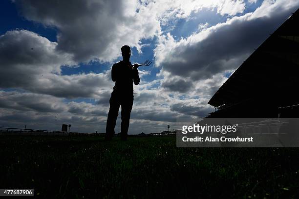 Groundsman works on the racecourse during Royal Ascot 2015 at Ascot racecourse on June 19, 2015 in Ascot, England.
