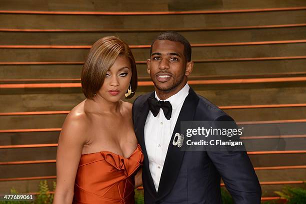 Athlete Chris Paul and guest Jada Crawley arrive to the 2014 Vanity Fair Oscar Party on March 2, 2014 in West Hollywood, California.