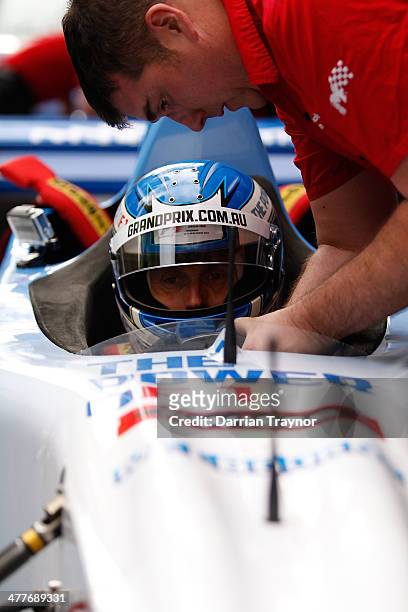 Driver Cameron McConville prepares to drive a twin seat grand prix car at Melbourne Town Hall on March 11, 2014 in Melbourne, Australia.