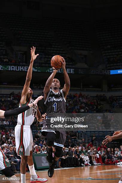 Doron Lamb of the Orlando Magic shoots against Giannis Antetokounmpo of the Milwaukee Bucks on March 10, 2014 at the BMO Harris Bradley Center in...