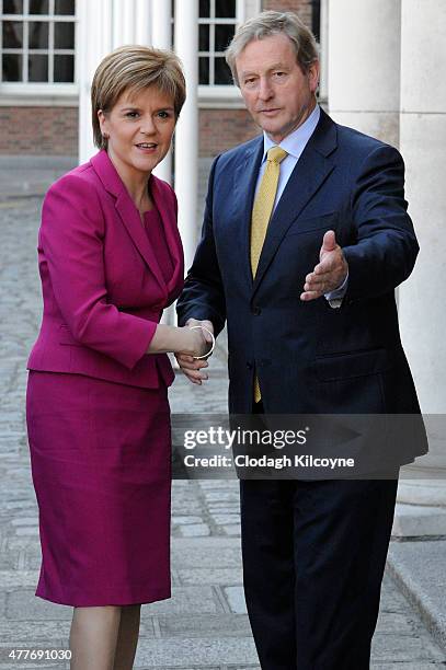 Scottish First Minister Nicola Sturgeon greets Irish Taoiseach Enda Kenny at the 24th British-Irish Council Summit at Dublin Castle on June 19, 2015...