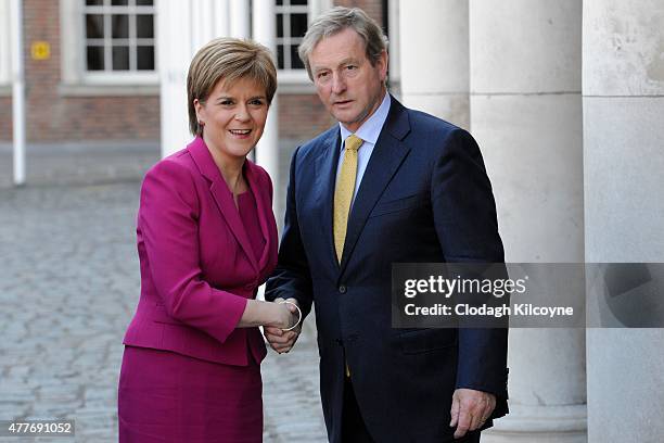 Scottish First Minister Nicola Sturgeon greets Irish Taoiseach Enda Kenny at the 24th British-Irish Council Summit at Dublin Castle on June 19, 2015...