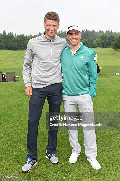 Thomas Mueller and Philipp Lahm attend the Young Wings Charity Golf Cup 2015 at Golfclub Munchen -Riedhof e.V. On June 19, 2015 in Munich, Germany.