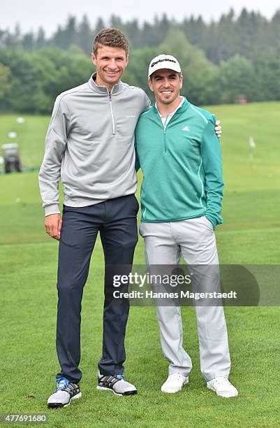 Thomas Mueller and Philipp Lahm attend the Young Wings Charity Golf Cup 2015 at Golfclub Munchen -Riedhof e.V. On June 19, 2015 in Munich, Germany.