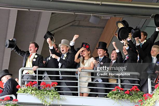 Racegoers cheer, on Ladies Day at Royal Ascot Racecourse on June 18, 2015 in Ascot, England.