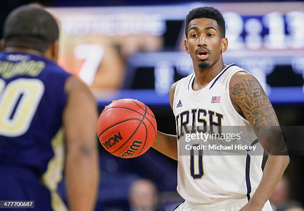 Eric Atkins of the Notre Dame Fighting Irish brings the ball up court during the game against the Georgia Tech Yellow Jackets at Purcel Pavilion on...