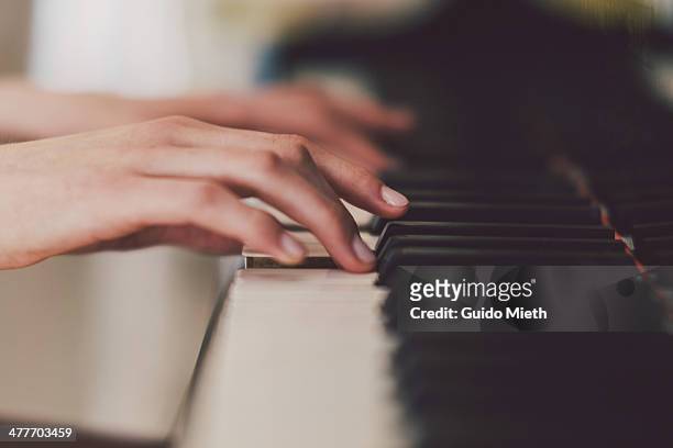playing piano - klavier stock-fotos und bilder