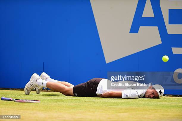 Guillermo Garcia-Lopez of Spain falls to the ground in his men's singles quarter-final match against Kevin Anderson of South Africa during day five...
