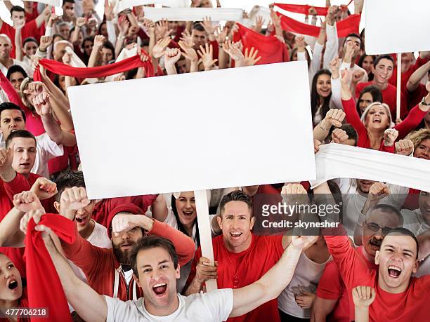 ecstatic large group of sport fans shouting and cheering. - placard stock pictures, royalty-free photos & images