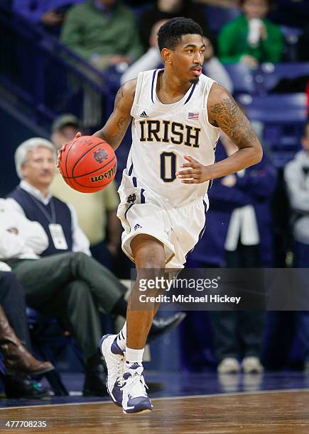 Eric Atkins of the Notre Dame Fighting Irish brings the ball up court during the game against the Georgia Tech Yellow Jackets at Purcel Pavilion on...