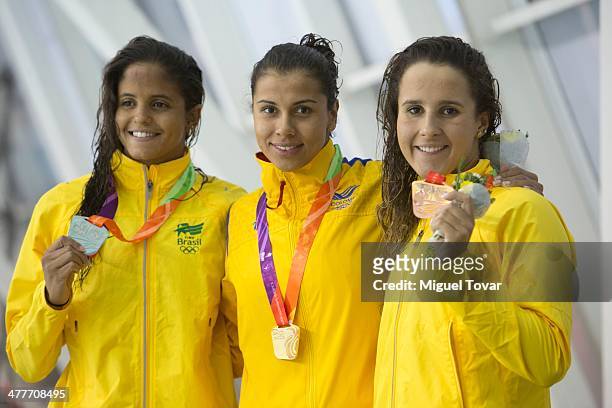 Carolina Colorado of Colombia poses after winning the gold medal with Natalia de Luccas and Etiene Pires of Brazil in womens 100m backstroke final...