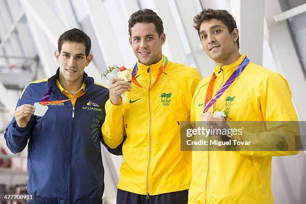 Thiago Teixeira of Brazil shows his gold medal with Esteban Enderica of Ecuador and Thiago Machado of Brazil in mens 400m individual medleyfinal...