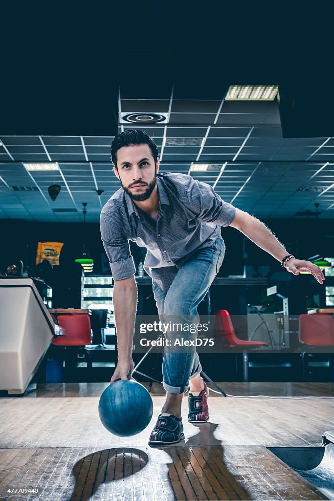 Man throwing bowling ball