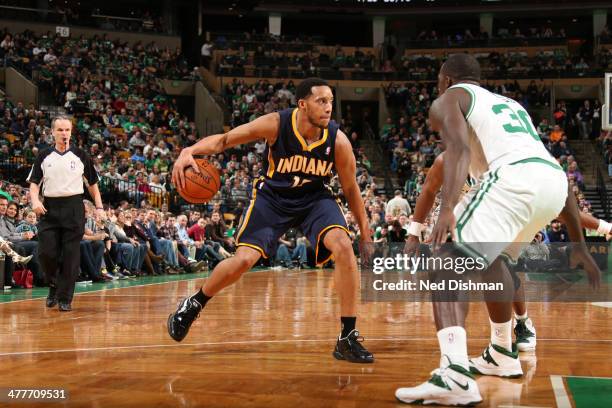 Evan Turner of the Indiana Pacers dribbles the ball against the Boston Celtics at the TD Garden on March 1, 2014 in Washington, DC. NOTE TO USER:...