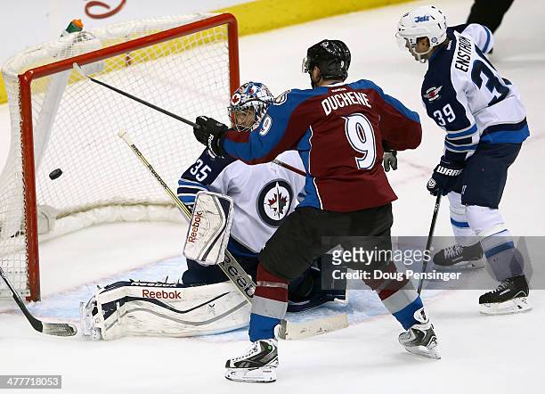 Matt Duchene of the Colorado Avalanche puts the puck past goalie Al Montoya of the Winnipeg Jets for the game winning goal in overtime at Pepsi...