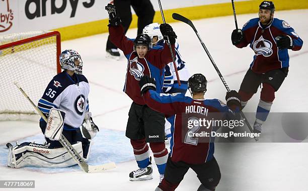 Matt Duchene of the Colorado Avalanche celebrates after scoring the game winning goal in overtime against goalie Al Montoya of the Winnipeg Jets as...