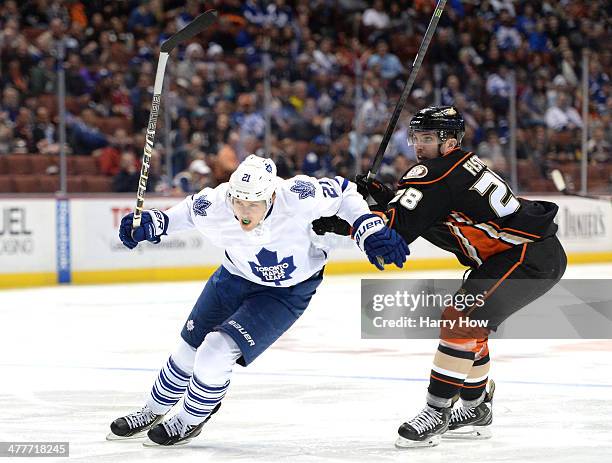 Mark Fistric of the Anaheim Ducks attempts to slow James van Riemsdyk of the Toronto Maple Leafs from the puck during the second period at Honda...