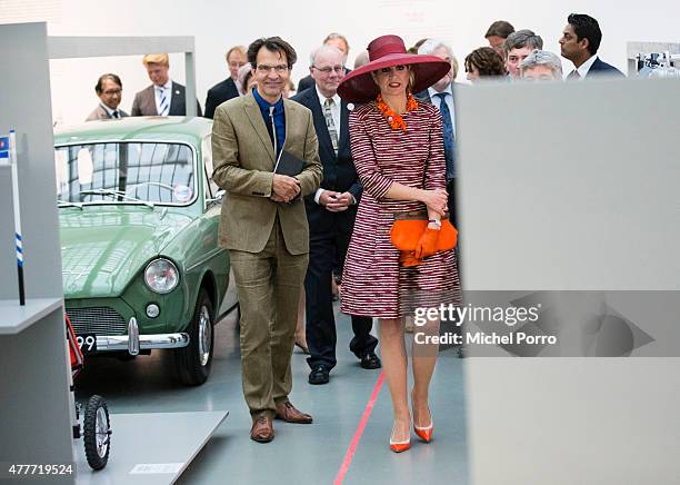 Queen Maxima of The Netherlands walks past a 50s Dutch-designed Daf 33 while opening the Design Derby Netherlands - Belgium on June 19, 2015 in...