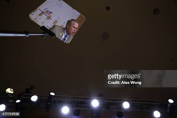 Republican U.S. Presidential hopeful and former Florida Governor Jeb Bush, seen as his image is reflected on a teleprompter, speaks during the "Road...