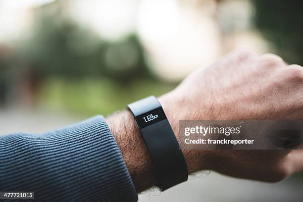 new fitbit force, sport fitness tracker - fitbit stock pictures, royalty-free photos & images