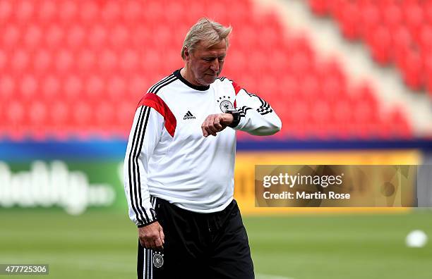 Horst Hrubesch, head coach of Germany looks on during a training session ahead of the EURO 2015 Group A match against Denmark at Eden stadium on June...