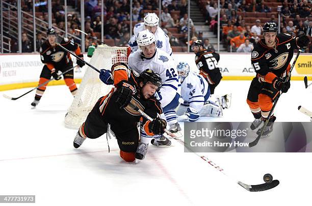 Matt Beleskey of the Anaheim Ducks attempts a pass to Ryan Getzlaf in front of Tyler Bozak of the Toronto Maple Leafs during a 3-1 Maple Leaf win at...