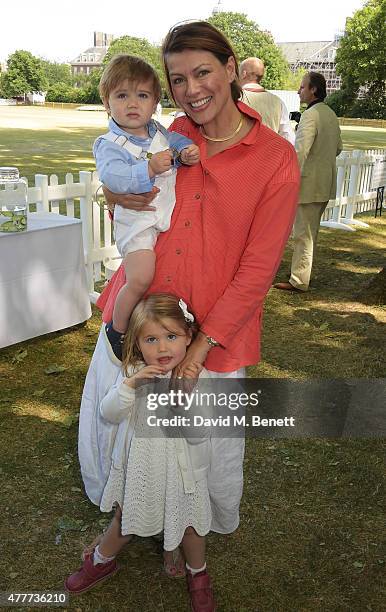 Kate Silverton, her son Wilbur and daughter Clemency attend the Flannels for Heroes charity cricket match and garden party hosted by menswear brand...