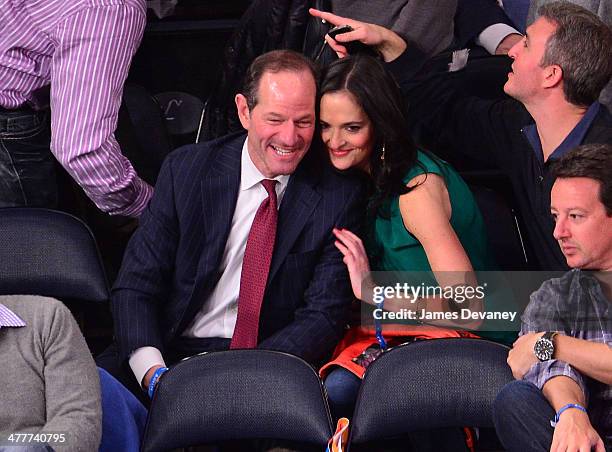 Eliot Spitzer and Lis Smith attend the Philadelphia 76ers vs New York Knicks game at Madison Square Garden on March 10, 2014 in New York City.