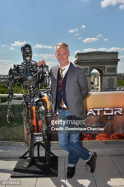 Director Alan Taylor poses with Endoskeleton during the France Photocall of 'Terminator Genisys' at the Publicis Champs Elysees on June 19, 2015 in...
