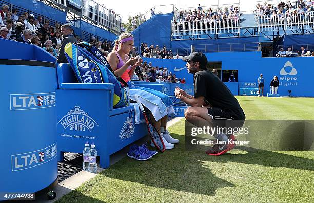 Sabine Lisicki of Germany speaks to her coach Christopher Kas in her quarter final match over Daniela Hantuchova of Slovakia on day five of the Aegon...