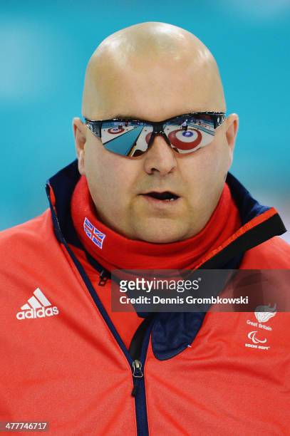 Gregor Ewan of Great Britain competes in the Round Robin Session 7 during day four of Sochi 2014 Paralympic Winter Games at Ice Cube Curling Center...