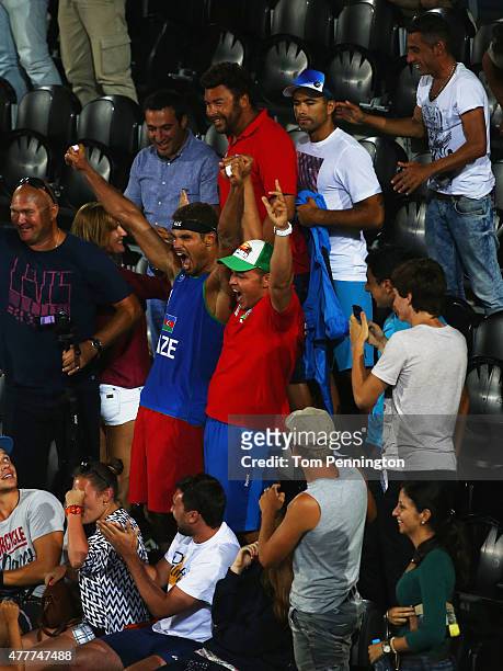 Player Neilton Santos of Azerbaijan celebrates victory in the stands with spectators during the Men's Beach Volleyball elimination round match...