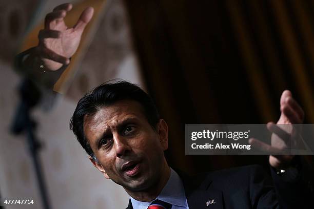 Louisiana Governor Bobby Jindal speaks during the "Road to Majority" conference as his hand is reflected June 19, 2015 in Washington, DC....