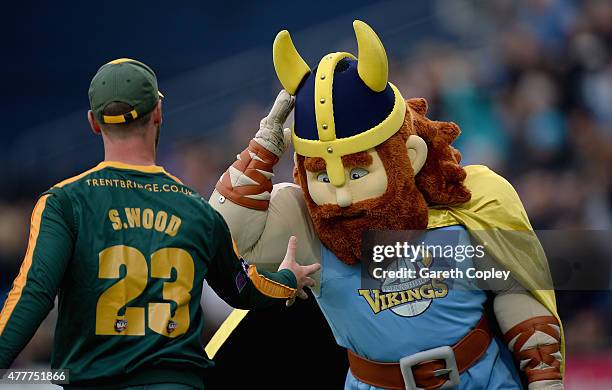 The Yorkshire Viking mascot jokes around with Sam Wood of Nottinghamshire during the NatWest T20 Blast match between Yorkshire and Nottinghamshire at...