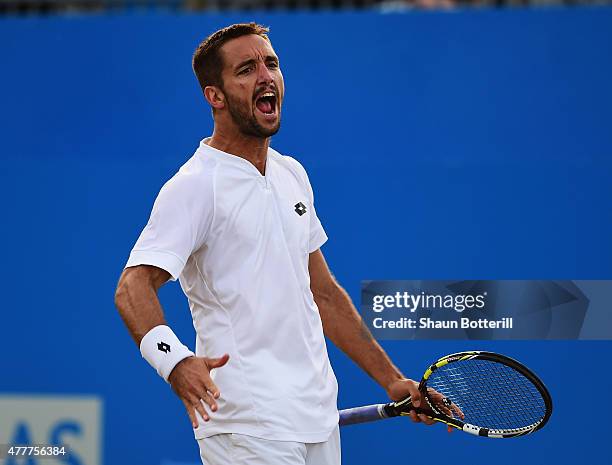 Viktor Troicki of Serbia celebrates in his men's singles quarter-final match against John Isner of USA during day five of the Aegon Championships at...