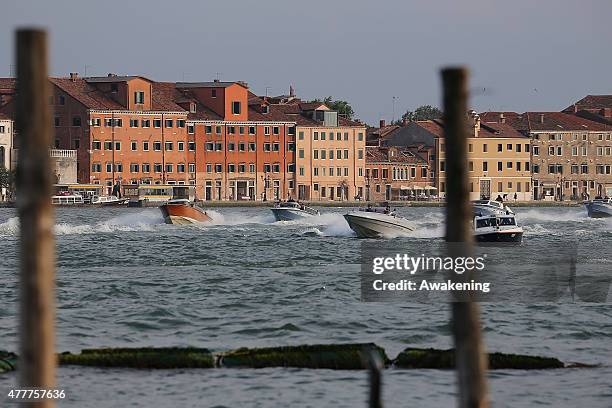 First Lady Michelle Obama and her daughters sit on the back of a Police boat leading to the Doge Palace on June 19, 2015 in Venice, Italy. Michelle...