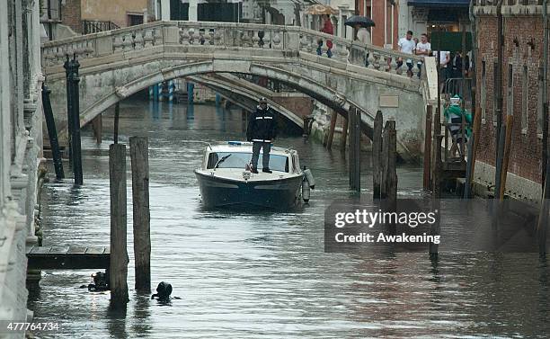 Police block a canal and divers inspect it ahead of the arrival to Saint Mark's Cathedral of First Lady Michelle Obama and her daughters on June 19,...