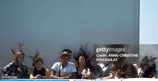 Fans watch the qualifying rounds of the French stage of the World Cup Skateboarding ISU during the Sosh Freestyle Cup, June 19, 2015 on the Prado...
