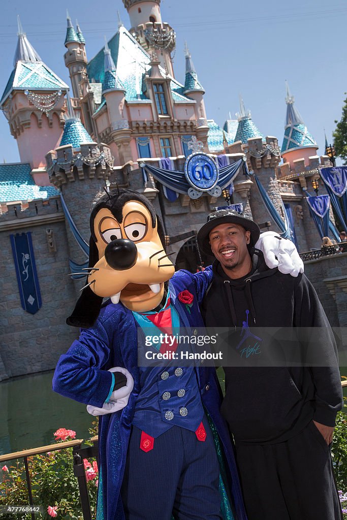 Nick Cannon Visits With Goofy At Disneyland