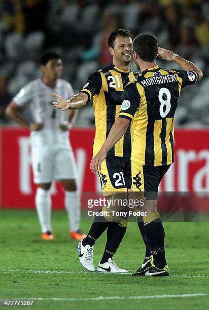 Mile Sterjovski of the Mariners celebrates a goal with team mate Nick Montgomery during the AFC Asian Champions League match between the Central...