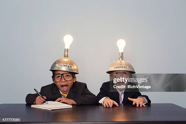 two young boy dressed in suits and thinking caps - nerd fun stock pictures, royalty-free photos & images