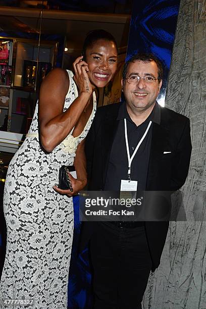 Ayo and Jean Jacques Amsellem attend Les Globes de Cristal 2014 Awards Ceremony at Le Lido on March 10, 2014 in Paris, France.