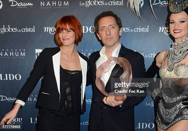 Fauve Hautot and Gad El Maleh attend Les Globes de Cristal 2014 Awards Ceremony at Le Lido on March 10, 2014 in Paris, France.