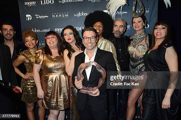 Dancers and singers from the Disco musical comedy attend Les Globes de Cristal 2014 Awards 9th Photocall at Le Lido on March 10, 2014 in Paris,...