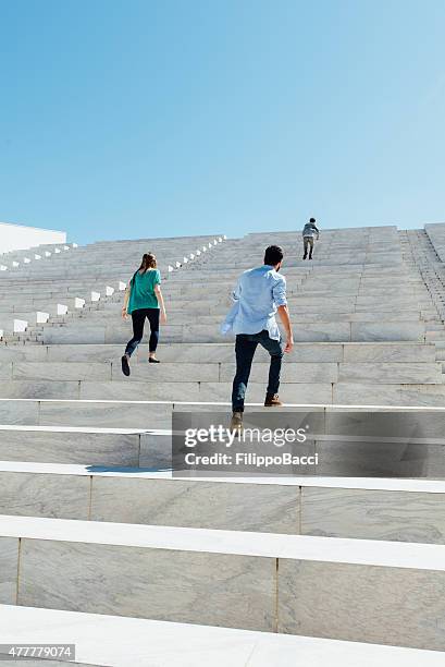 reaching the top - climbing ladder of success stock pictures, royalty-free photos & images